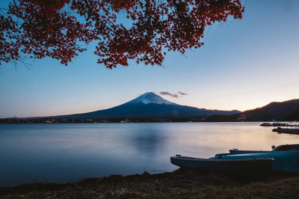 Mirror-like reflection of Mount Fuji in Lake Kawaguchiko, Yamanashi, Japan. A classic and serene view of Japan's iconic mountain.