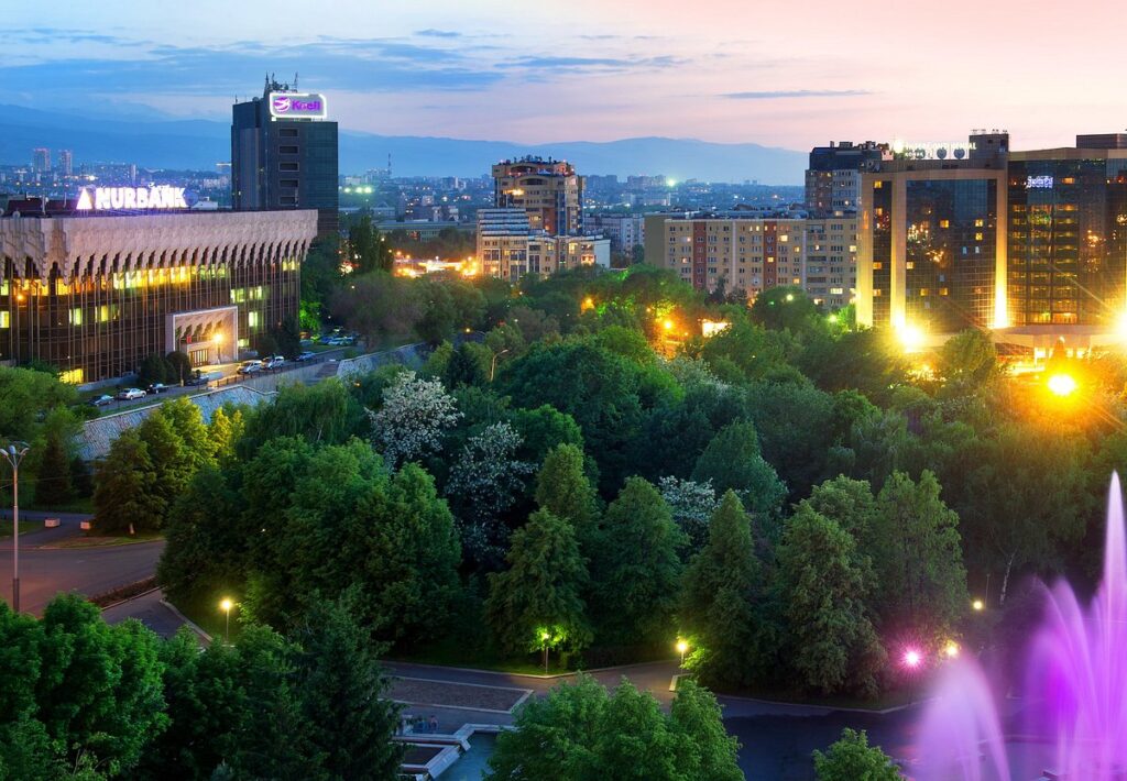 Almaty cityscape view showcasing the unique mountain city proximity with Tian Shan mountains in the background
