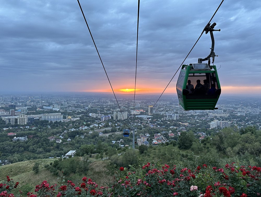 Kok Tobe hill cable car and tv tower overlooking the panoramic city view of Almaty Kazakhstan