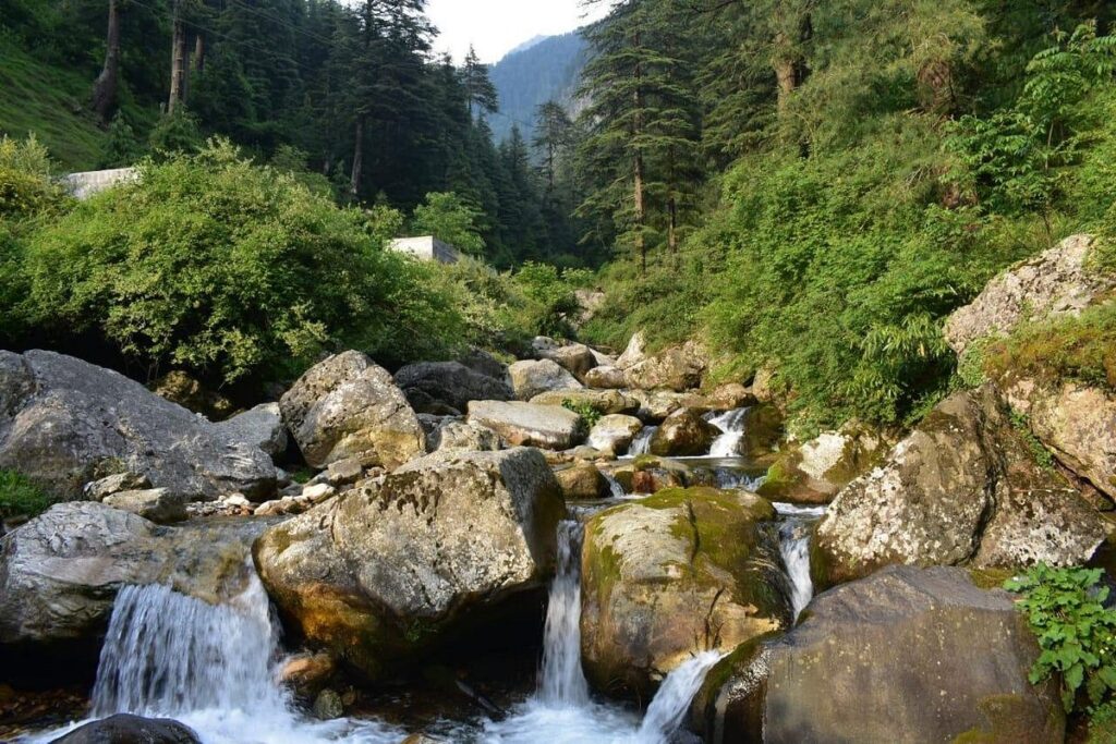 Hidden mountain village nestled among green landscapes in the Indian Himalayas