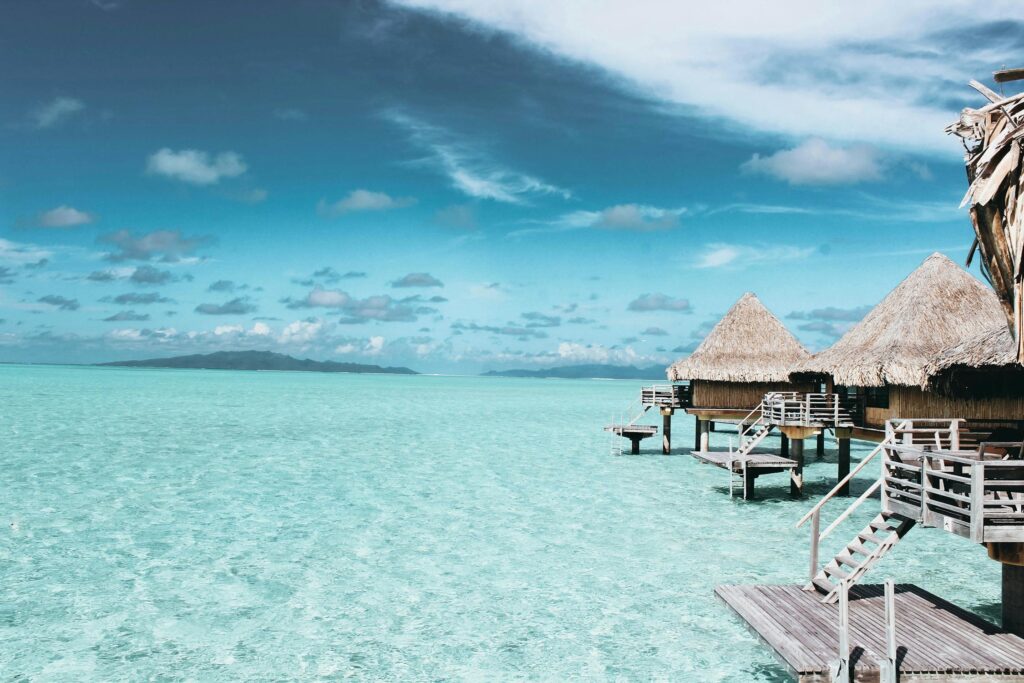 Vaitāpē, Îles Sous-le-Vent, French Polynesia
Three Brown Wooden Cottage and Sea