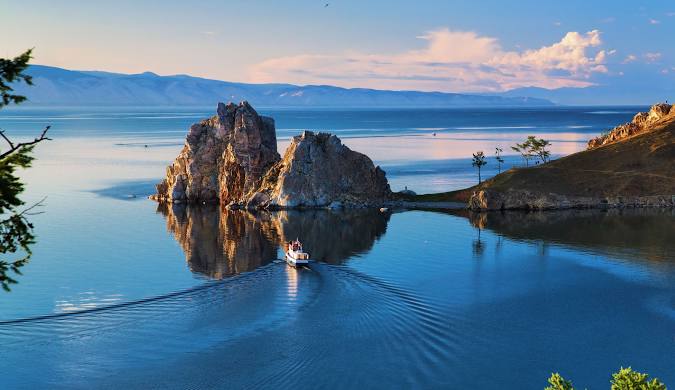 The rocky shoreline of Lake Baikal, featuring unique rock formations and clear turquoise water.