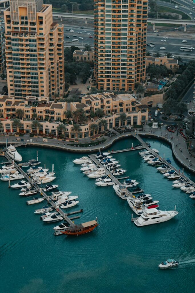 Luxury boating experience in Qatar: A modern yacht cruising along the coast of Doha.