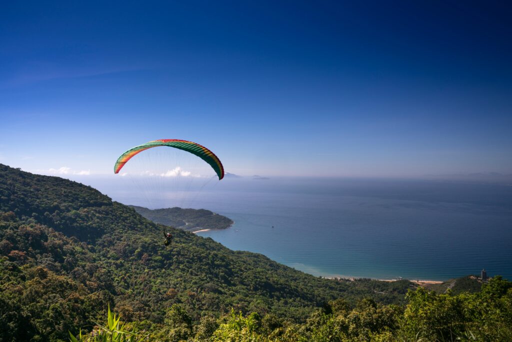 Parachuting Man Above Mountain,  Da Nang: Vietnam