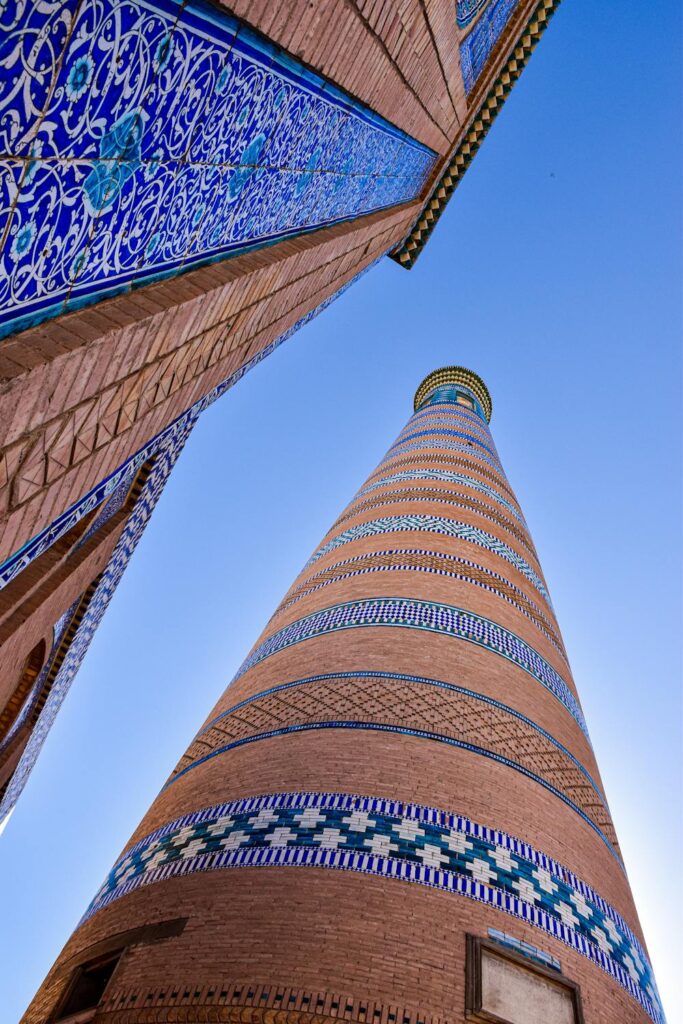 Blue-domed minarets in Uzbekistan, showcasing traditional Islamic architecture.