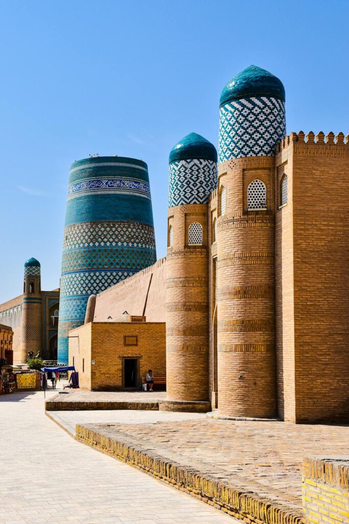 Blue-domed minarets in Uzbekistan, showcasing traditional Islamic architecture.