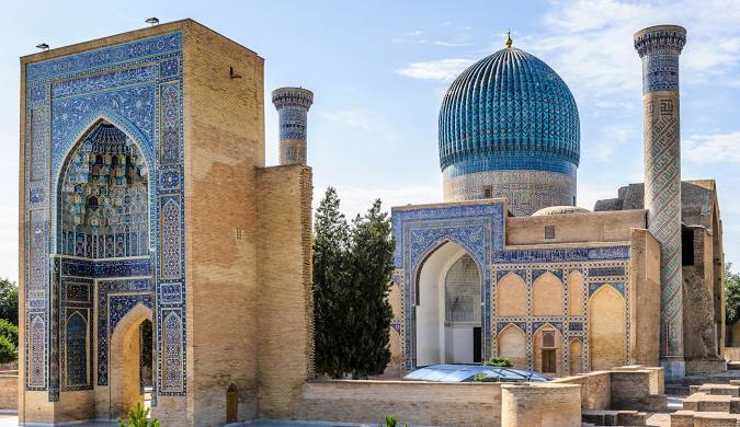 Blue-domed minarets in Uzbekistan, showcasing traditional Islamic architecture.