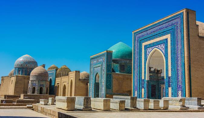 Blue-domed minarets in Uzbekistan, showcasing traditional Islamic architecture.