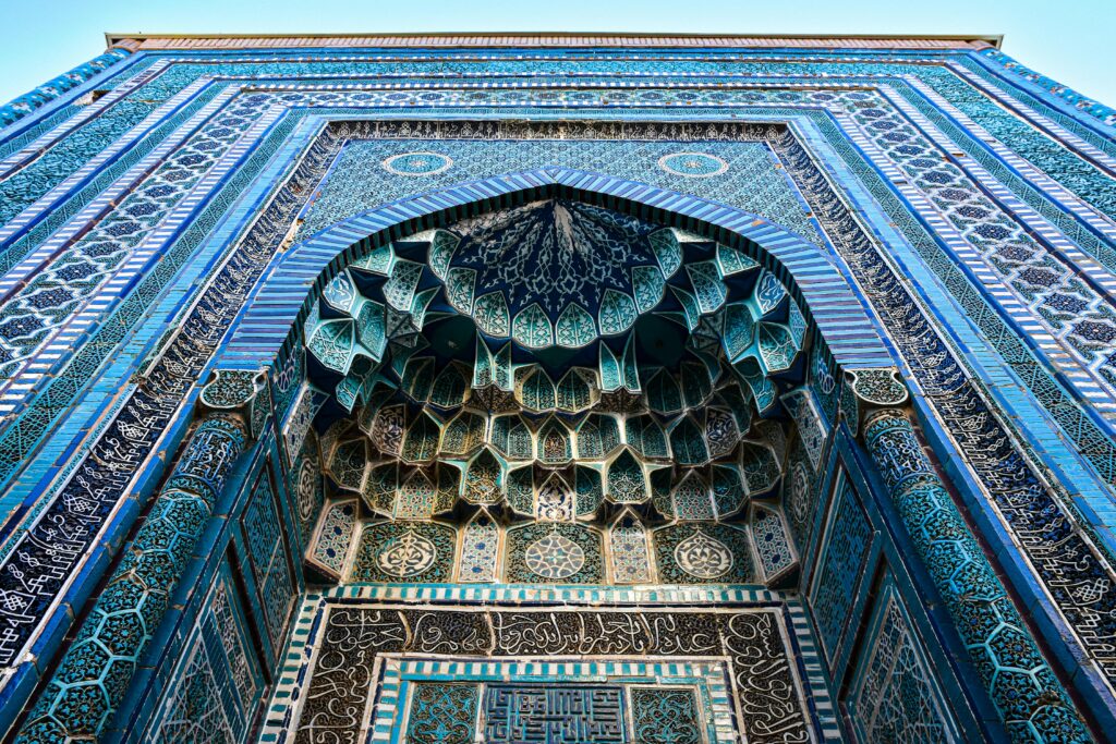 Blue-domed minarets in Uzbekistan, showcasing traditional Islamic architecture.
