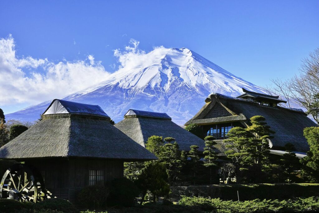 Gray Huts Near Snow-capped Mountain, Japan