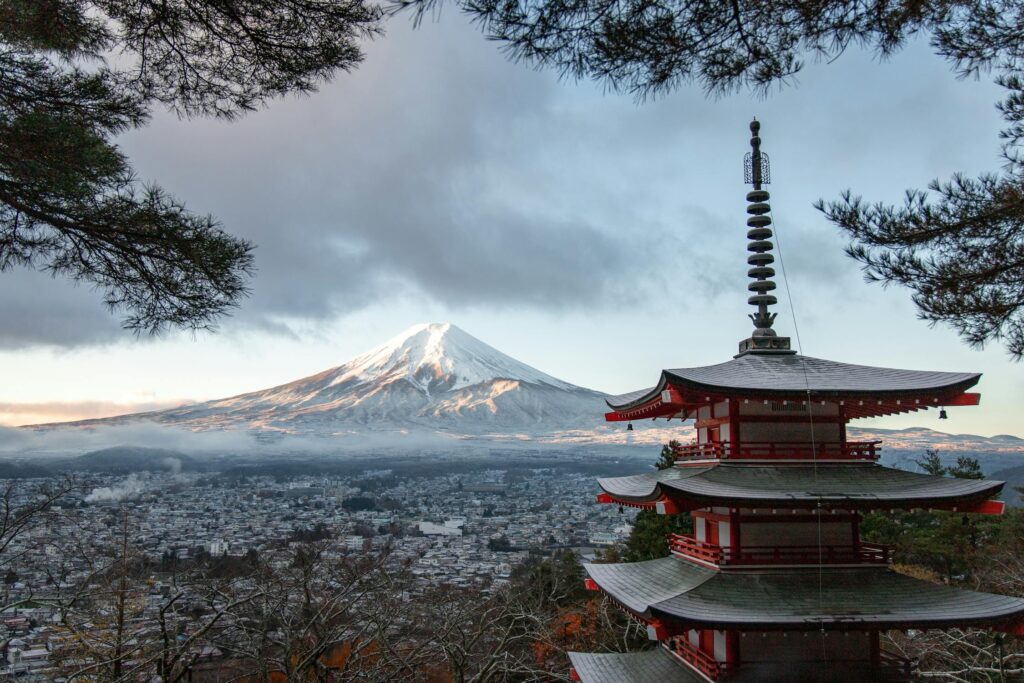 Mount Fuji towering over Fujinomiya, Shizuoka, Japan. The town sits at the base of the iconic mountain, offering stunning views.