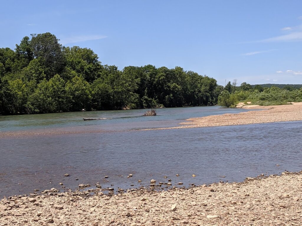 hallow river with gravel banks in Mark Twain National Forest. Explore the accessible riverbanks and wading opportunities along the Missouri River during your Mark Twain National Forest camping and hiking trip.