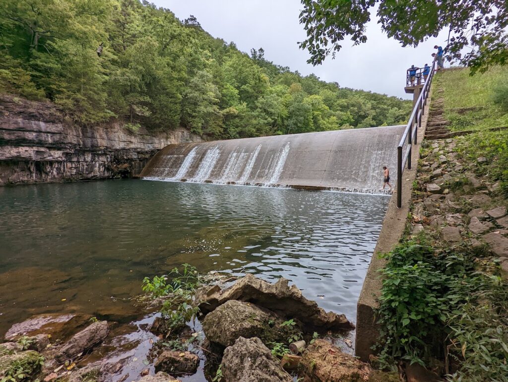 Small dam waterfall in a river in Mark Twain National Forest. Find hidden waterfalls and unique water features while exploring Mark Twain National Forest, enhancing your Ozark hiking experience.