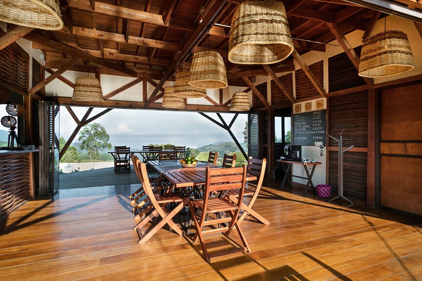 Exterior façade of Café Cóndor Salento, Colombia with colourful signage and outdoor seating