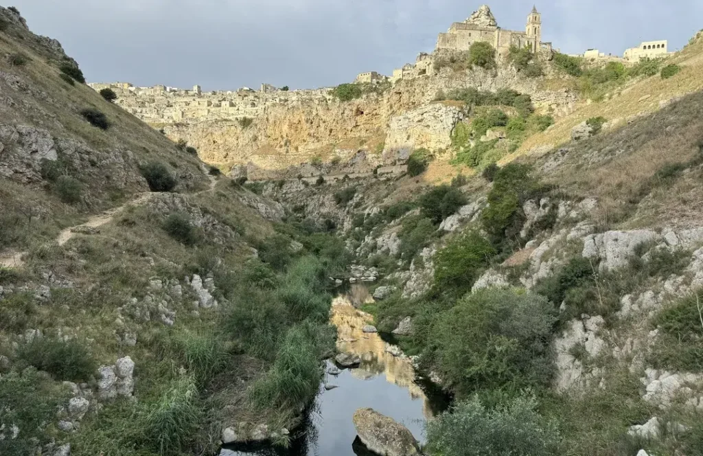 Hiking path across Gravina di Matera ravine, Italy