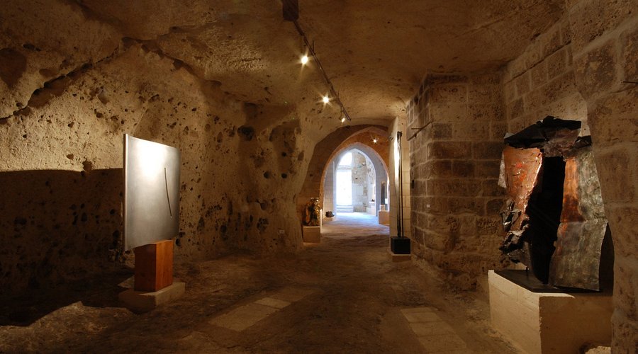 Contemporary sculpture installation inside MUSMA cave museum, Matera