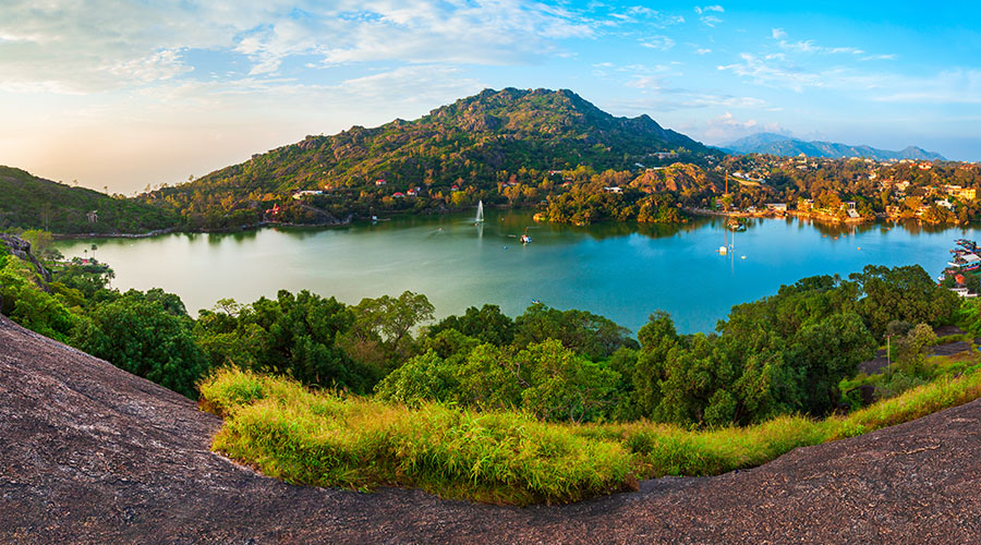 Scenic winding road approaching Mount Abu during hill-station season