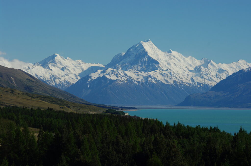 Wide scenic view of New Zealand mountains and lakes welcoming travelers