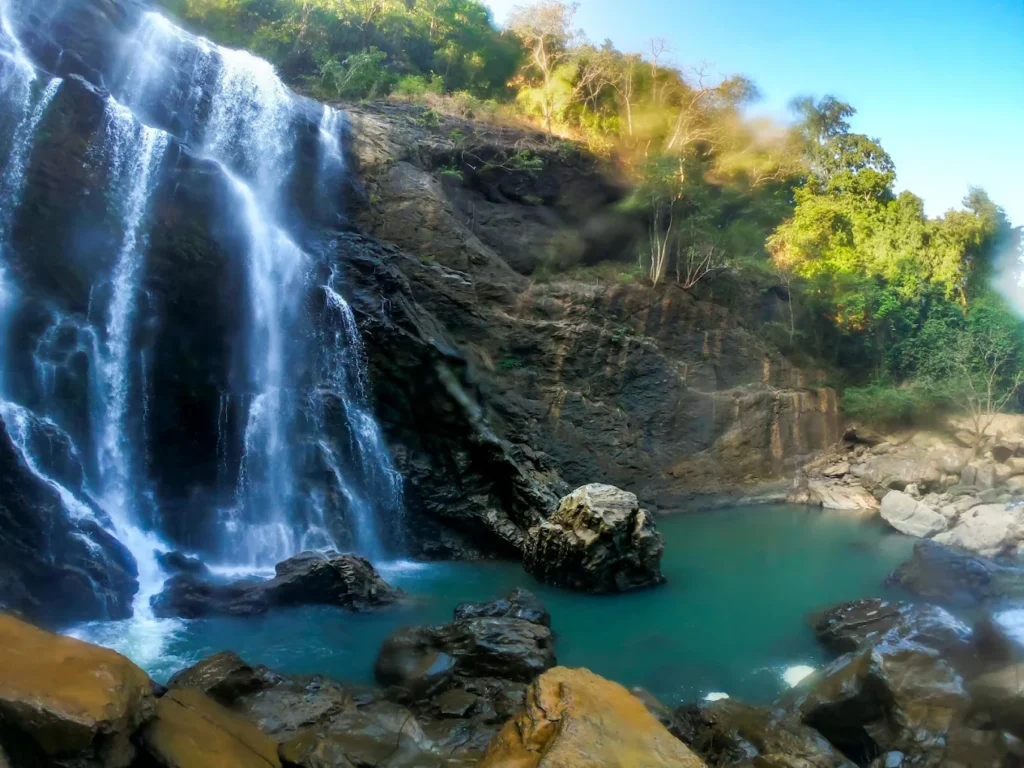 Panoramic view of Sathodi Falls cascading down the rocky cliff in Uttara Kannada, Karnataka