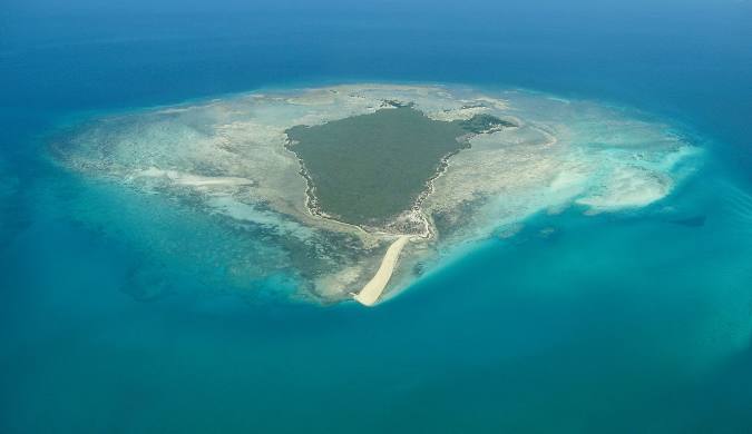 Remote beach on Quirimba Island with untouched coastline and minimal development, offering an authentic explorer-style experience in the Quirimbas Archipelago.