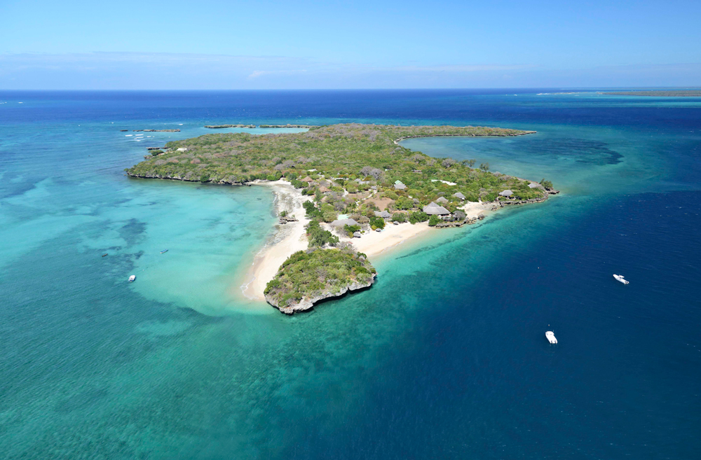 Aerial view of Quilalea Island and surrounding coral-lined islands in the Quirimbas Archipelago, Mozambique