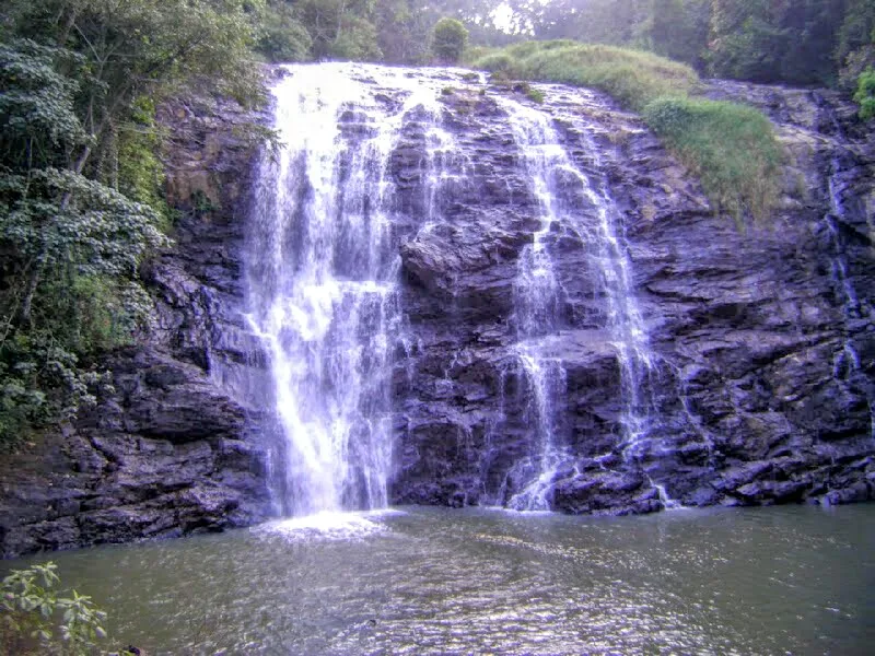 Wide panoramic view of a serene beach with gentle waves lapping the shore